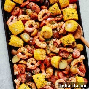 Easy One Pan Shrimp Boil 7 overhead photo of shrimp boil on a baking sheet, showcasing vibrant colors and textures