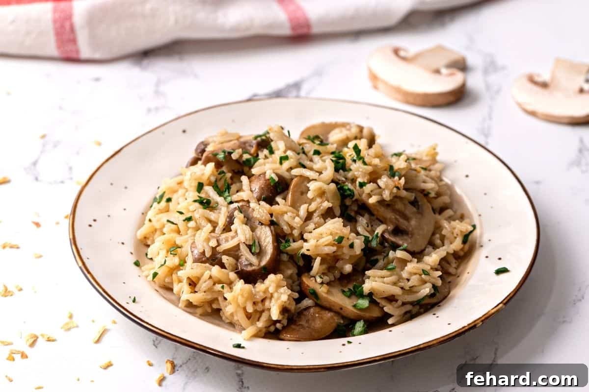 Fluffy Rice Pilaf with Mushrooms and Parsley A beautifully presented plate of fluffy Rice Pilaf with tender mushrooms and fresh parsley, showcasing its light and airy texture, ready to be enjoyed.