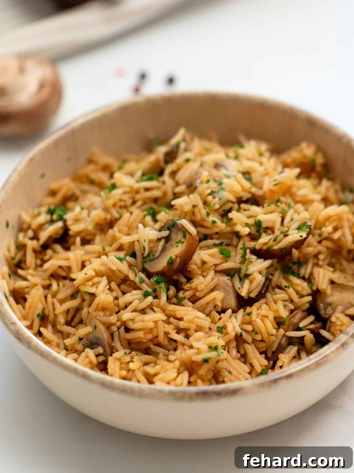 Bowl of Instant Pot Rice with mushrooms and seasonings, garnished with fresh parsley.