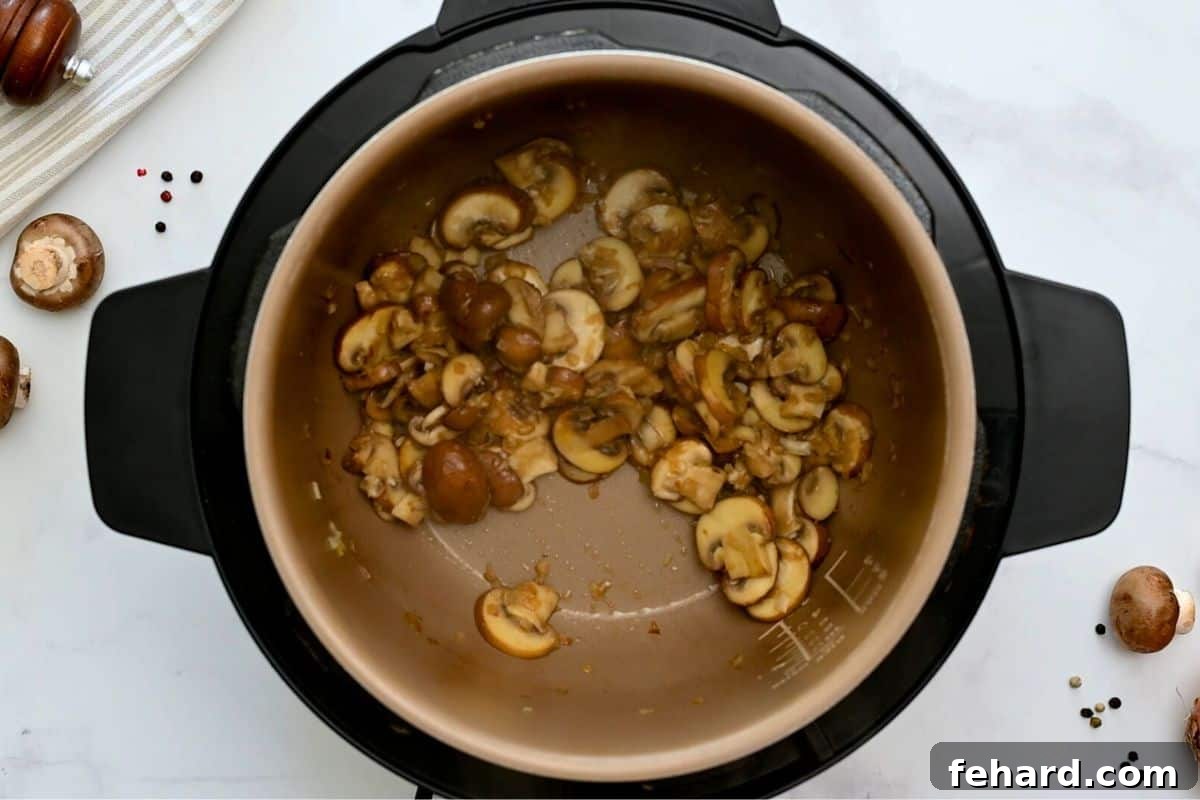 Sautéed onions and mushrooms in butter inside the Instant Pot before adding other ingredients.