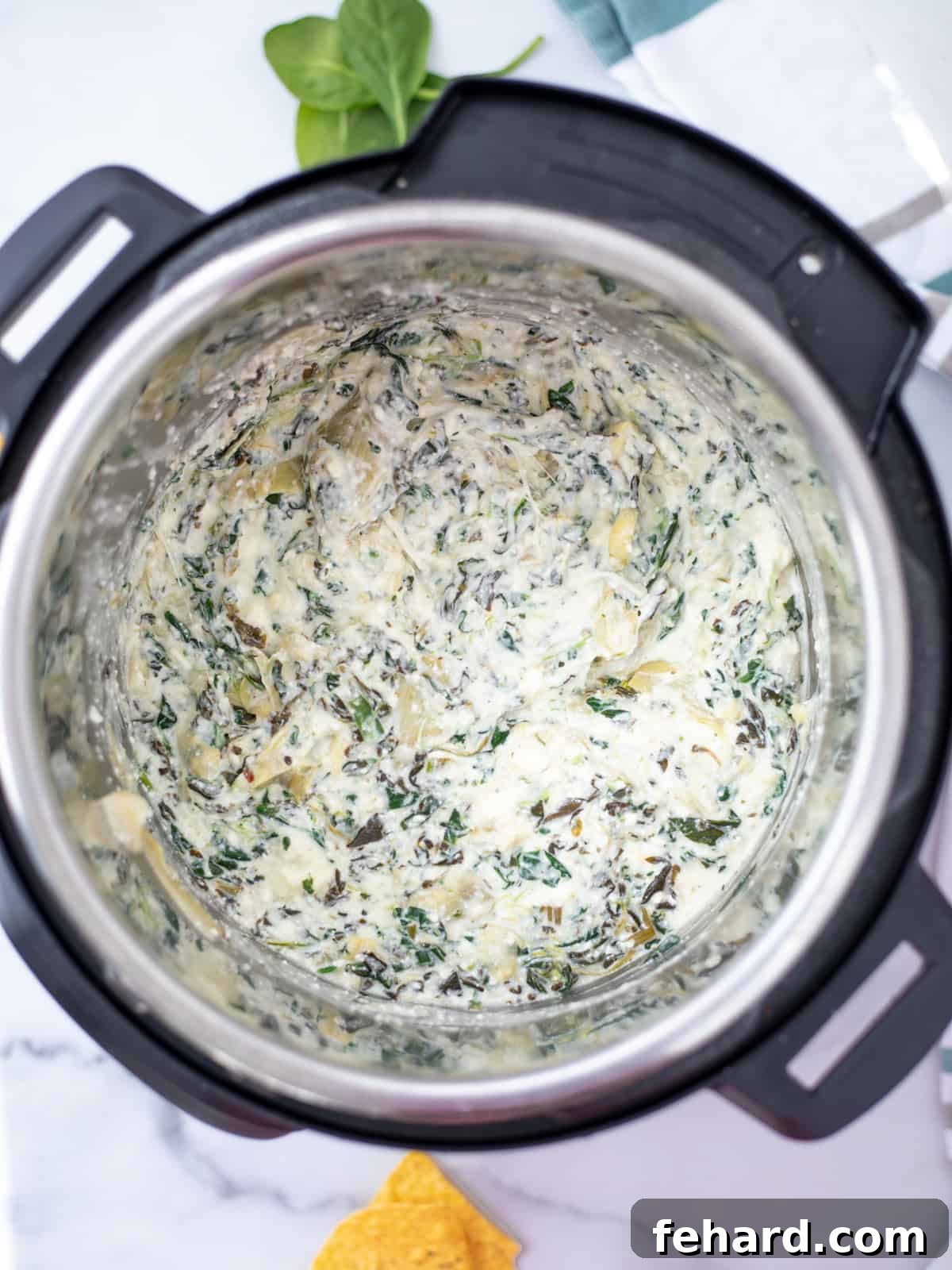 Instant Pot Spinach Artichoke Dip Recipe Creamy Instant Pot Spinach Artichoke Dip served in a bowl, ready to eat.