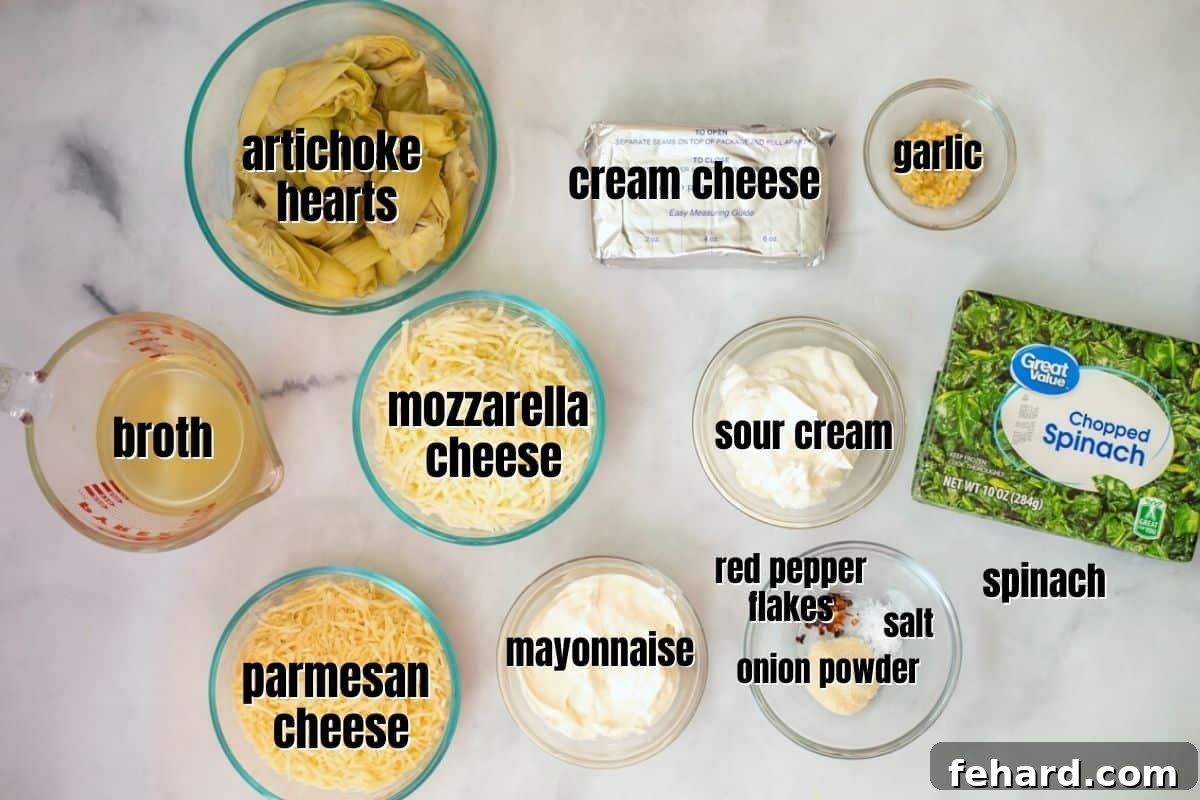 Ingredients for Instant Pot Spinach Dip Individual ingredients for Instant Pot Spinach Artichoke Dip laid out on a kitchen counter.