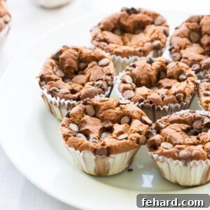 One-Bowl Blender Banana Oatmeal Muffins 6 A freshly baked Blender Banana Oatmeal Muffin, showing its inviting texture and golden-brown top.