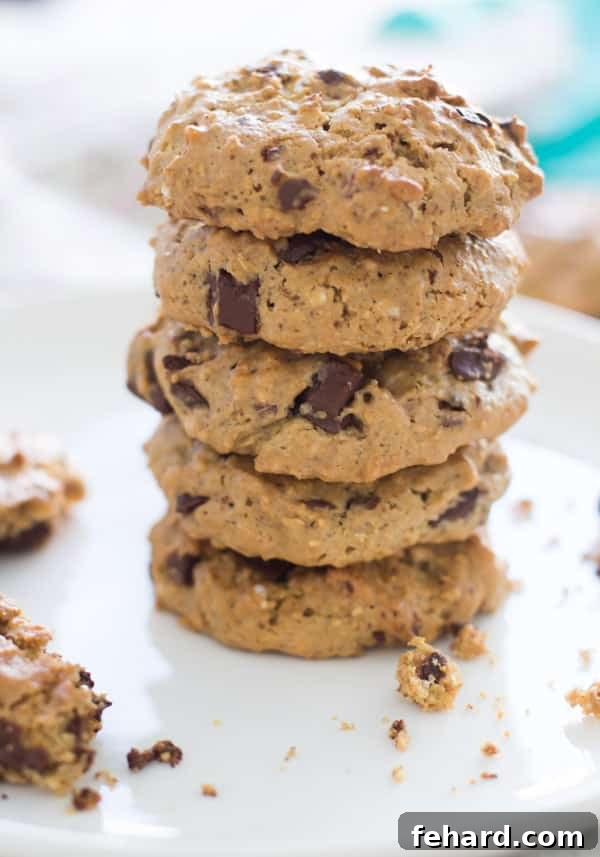 One-Bowl Blender Banana Oatmeal Muffins 7 Gluten-free Almond Butter Oatmeal Cookies on a cooling rack.
