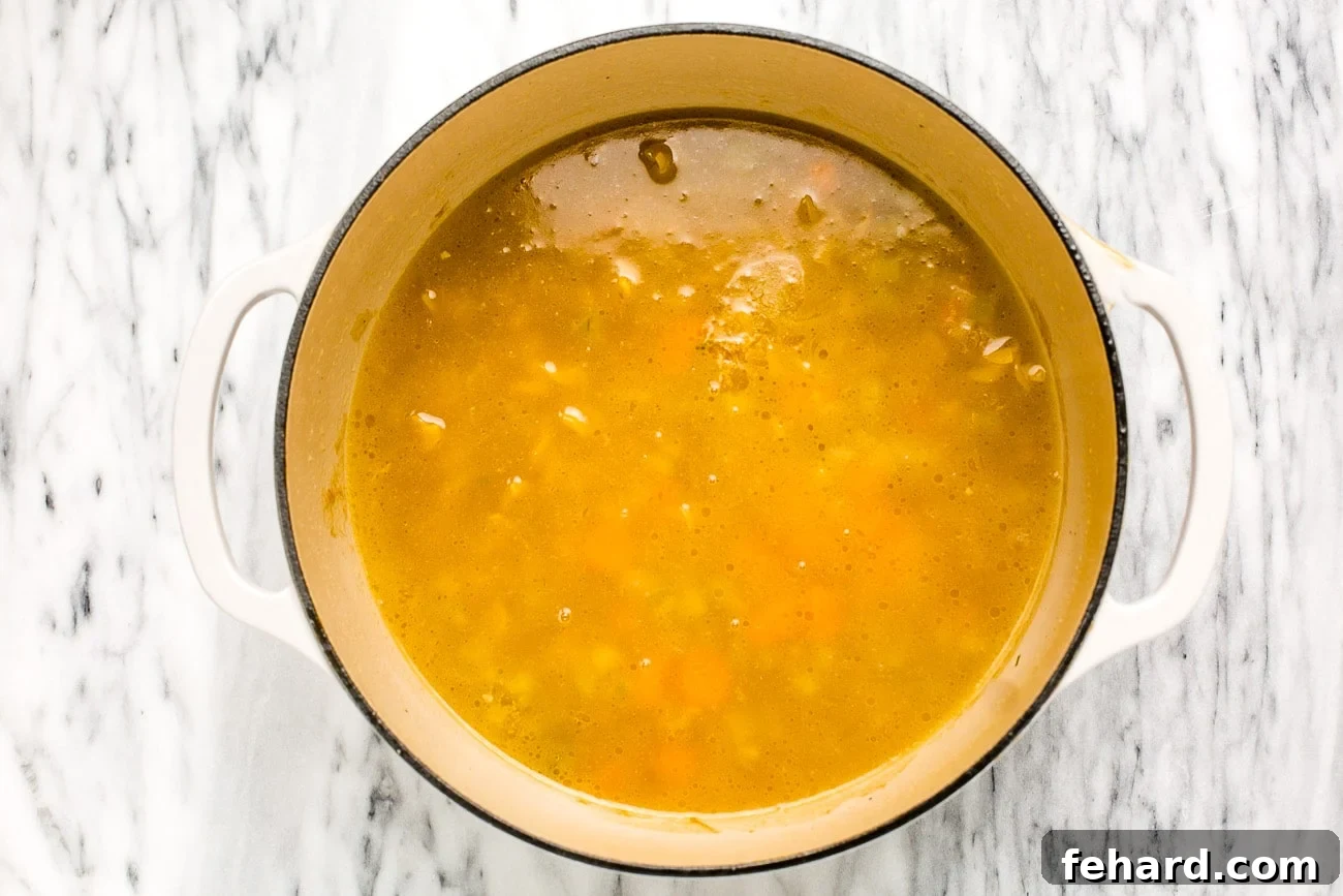 Broth added to chicken and veggies.