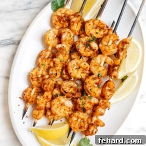 overhead view of cajun shrimp skewers prepared for grilling