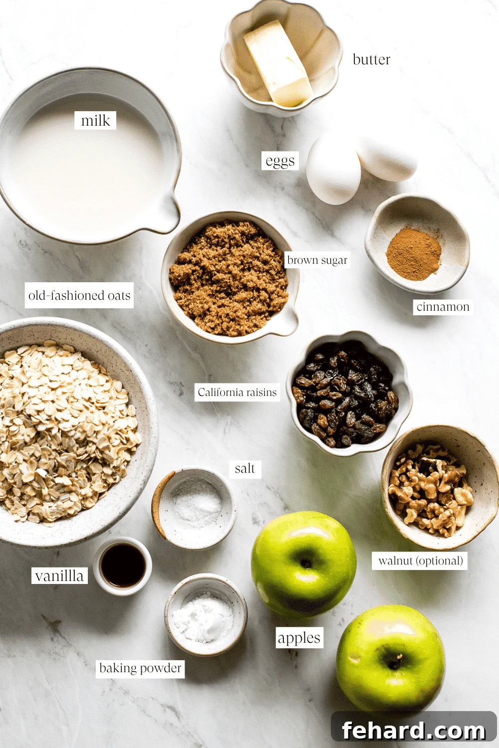 Comforting Apple Raisin Oatmeal Bake 3 A vibrant flat lay showcasing the key ingredients for Apple & Raisin Baked Oatmeal: rolled oats, fresh Granny Smith apples, plump raisins, brown sugar, cinnamon sticks, and milk, ready for preparation.