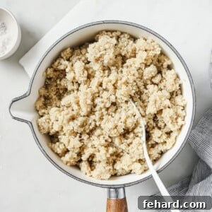 A bowl of fluffy cooked quinoa, perfectly prepared, ready to be served.
