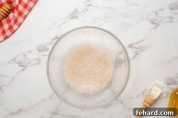 Spinach Pizza 4 Yeast foaming in water in small bowl.