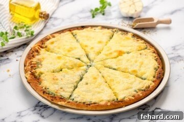 Spinach Pizza 11 Baked Spinach Pizza on pizza sheet cut into 8-wedges.