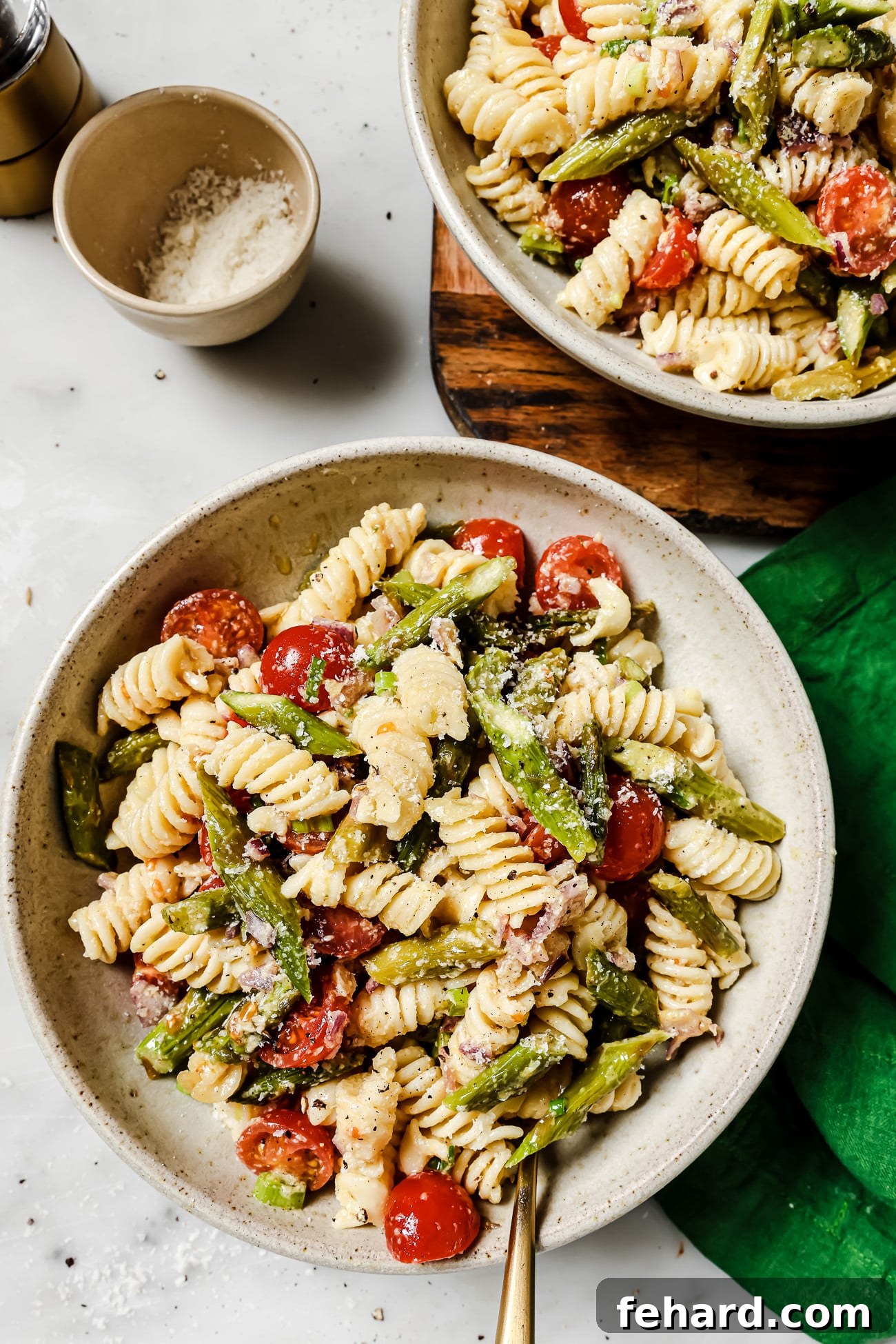 Vibrant Asparagus Pasta Salad 5 Two serving bowls filled with fresh asparagus pasta salad, ready to be enjoyed.