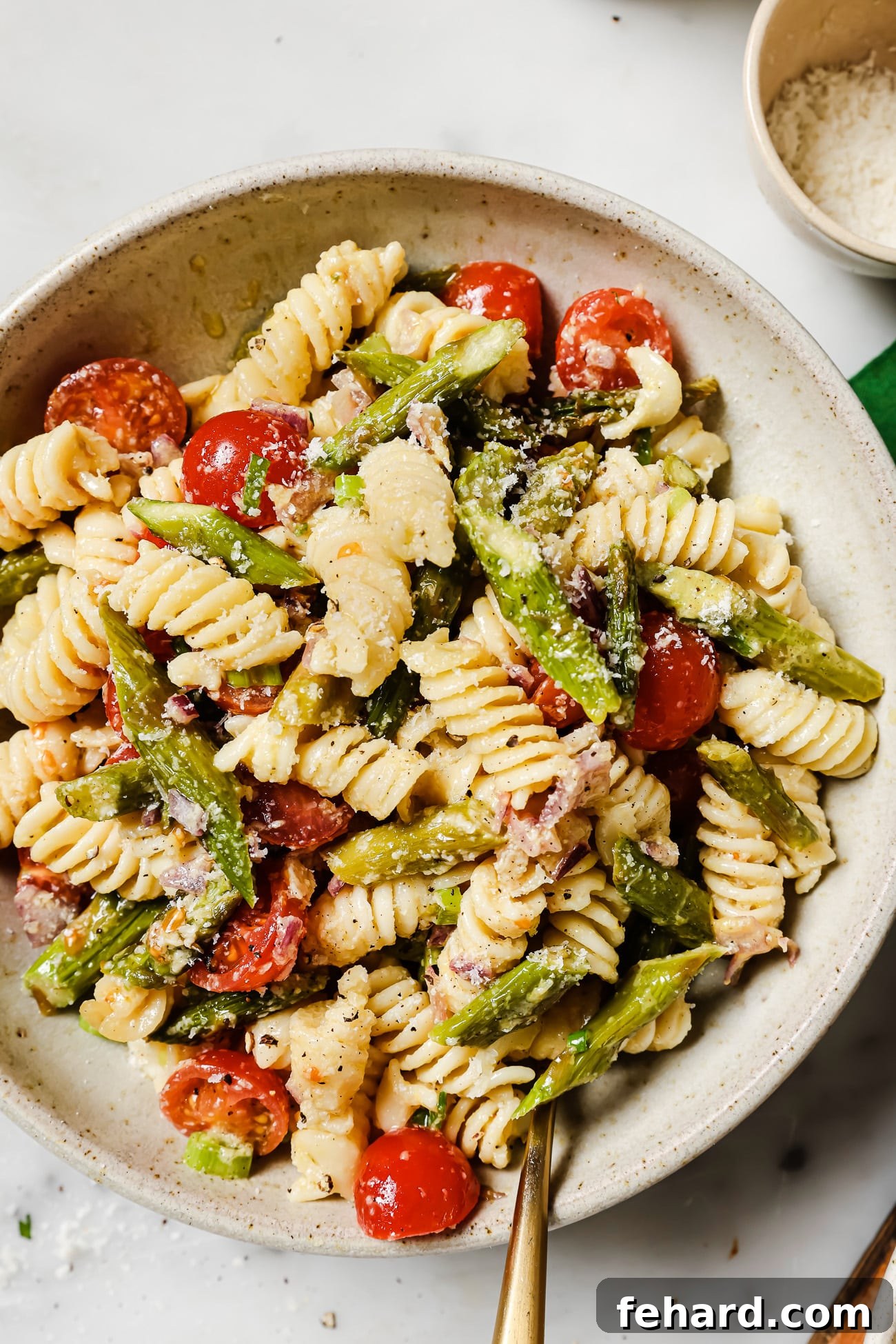 Vibrant Asparagus Pasta Salad 6 A single bowl of asparagus pasta salad, showcasing its vibrant ingredients and fresh appeal.