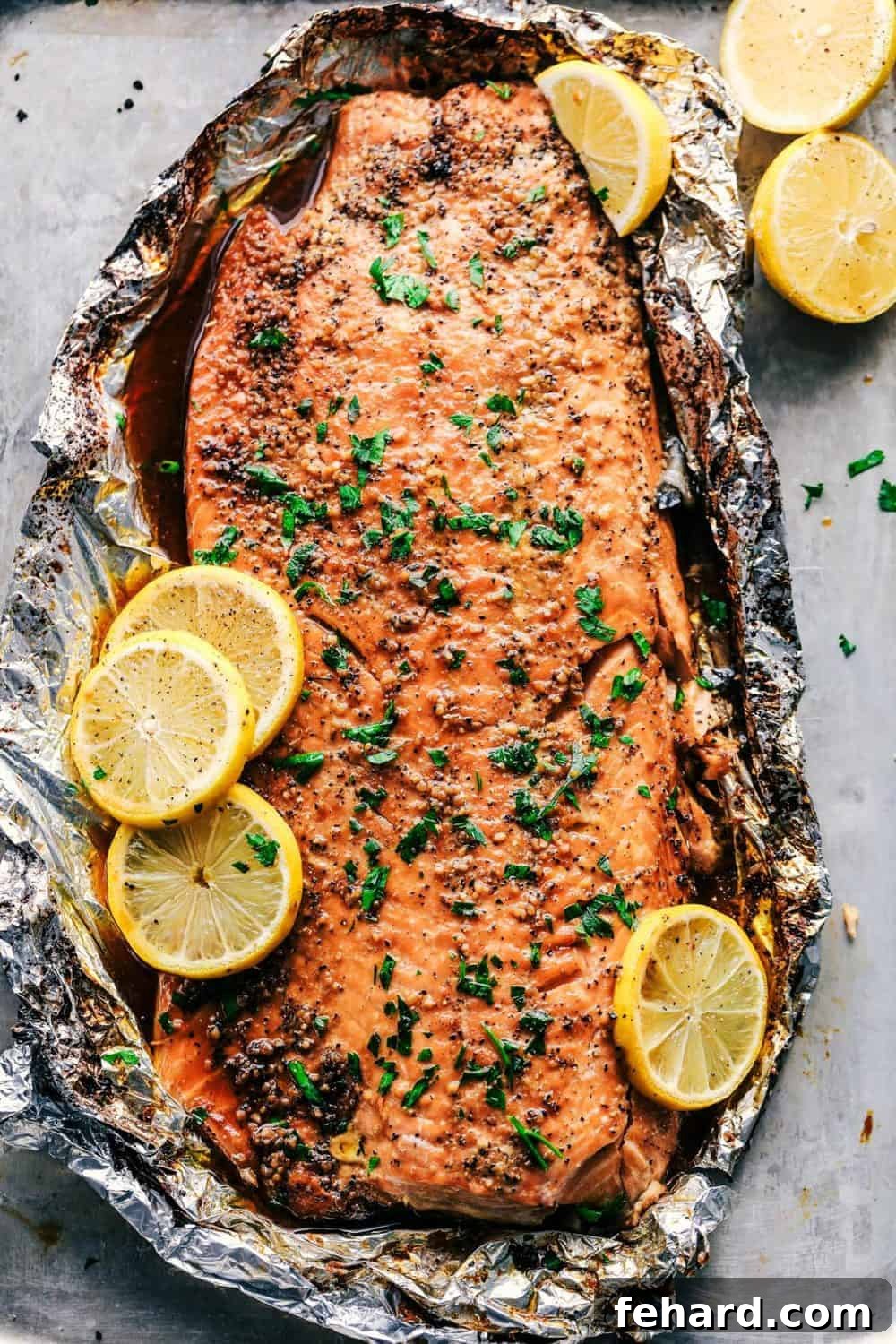 Any Night Salmon Dinner Recipes Baked Pan Seared or Broiled 13 An overhead view of a succulent salmon fillet, baked to perfection on a baking sheet.