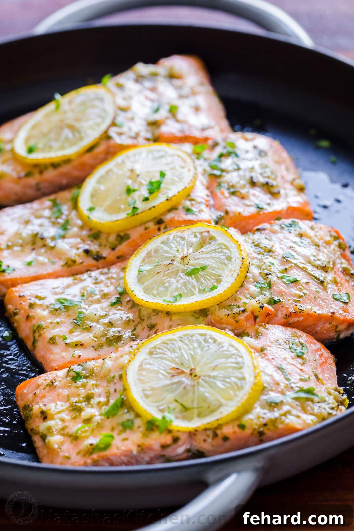 Any Night Salmon Dinner Recipes Baked Pan Seared or Broiled 5 An overhead view of a cast iron skillet holding deliciously baked salmon.