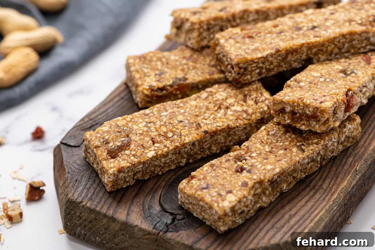 Homemade Granola Bar Slices A batch of freshly cut homemade granola bars arranged neatly on a wooden cutting board, with a sprinkle of nuts in the background, showcasing their uniform shape and appealing texture, ready to be enjoyed.