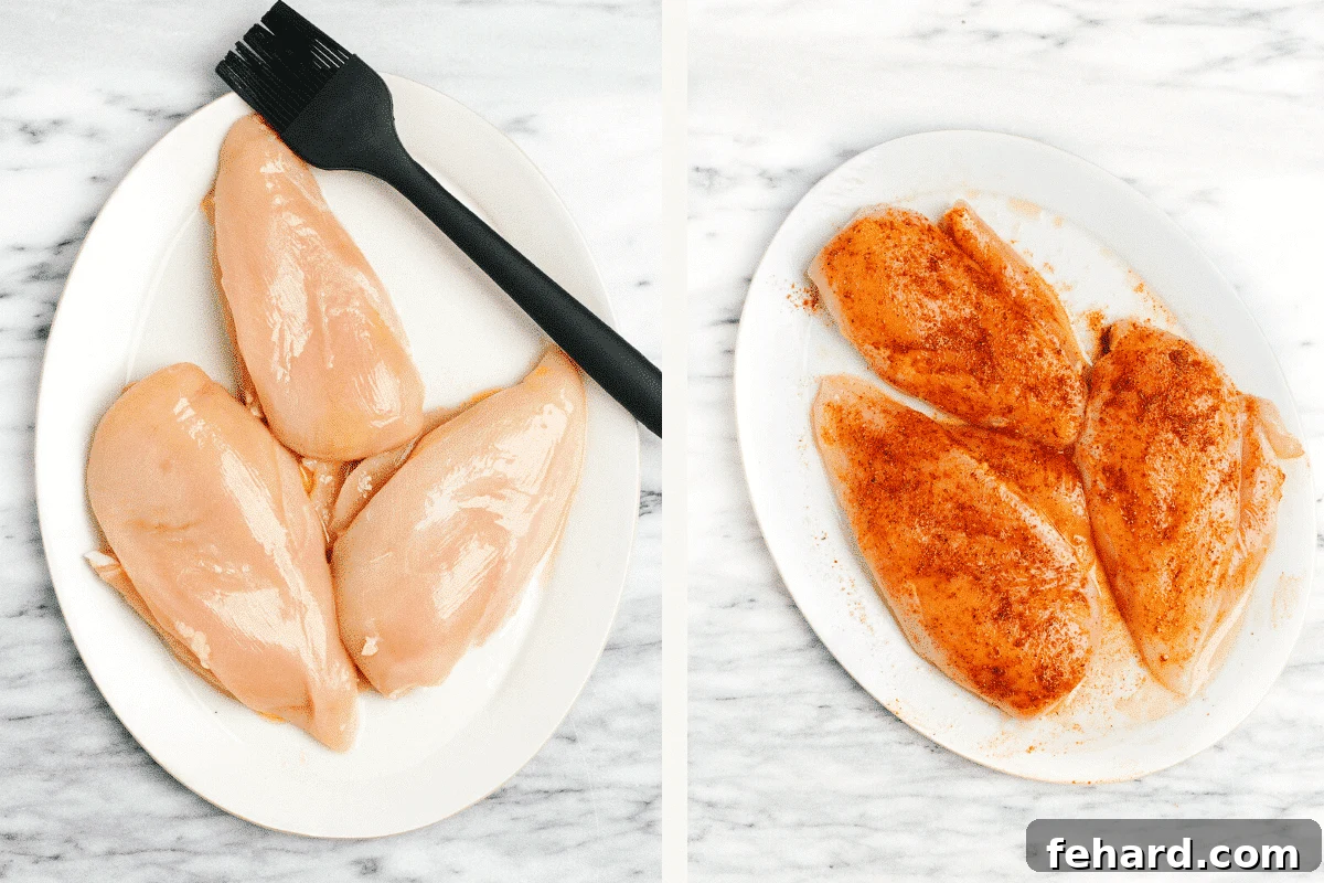 Two chicken breasts on a white plate: one raw, the other seasoned with paprika, salt, and pepper, ready for grilling.