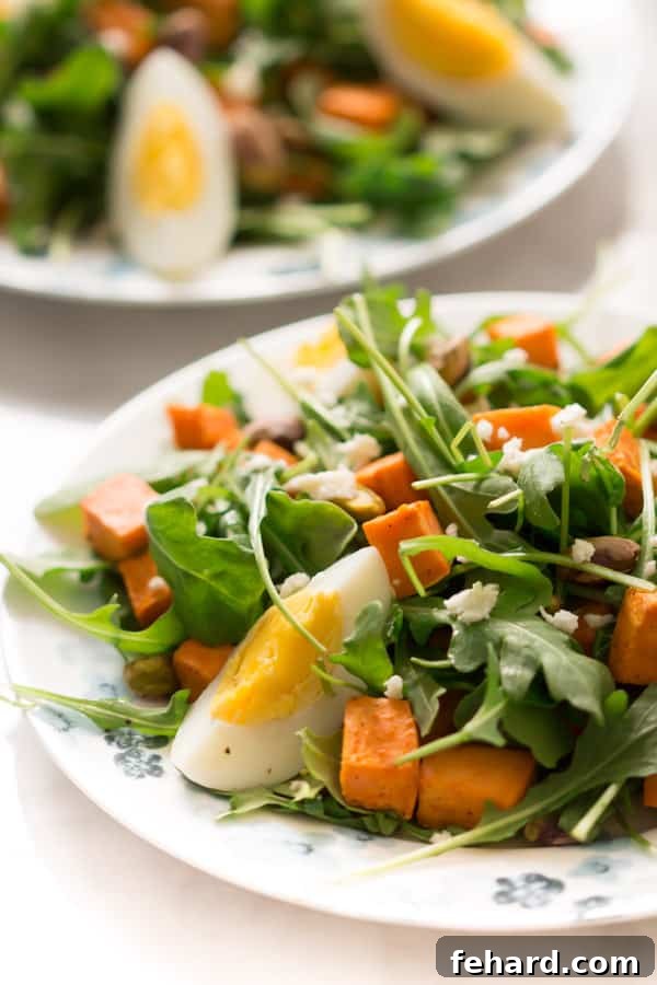 Sweet Potato Arugula Salad with pistachios, feta, and honey Dijon vinaigrette