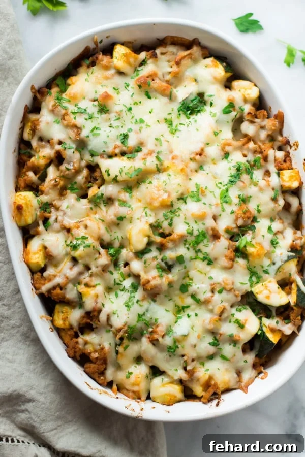 Sweet Potato Zucchini Casserole - A delightful and healthy casserole recipe. Close-up of baked Sweet Potato Zucchini Casserole, showcasing golden cheese and tender vegetables.