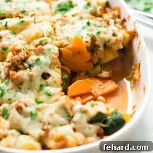 Cooked Sweet Potato Zucchini Casserole, garnished with fresh parsley.