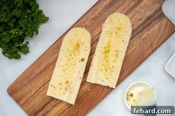 Seasoned olive oil brushed on sliced French bread.