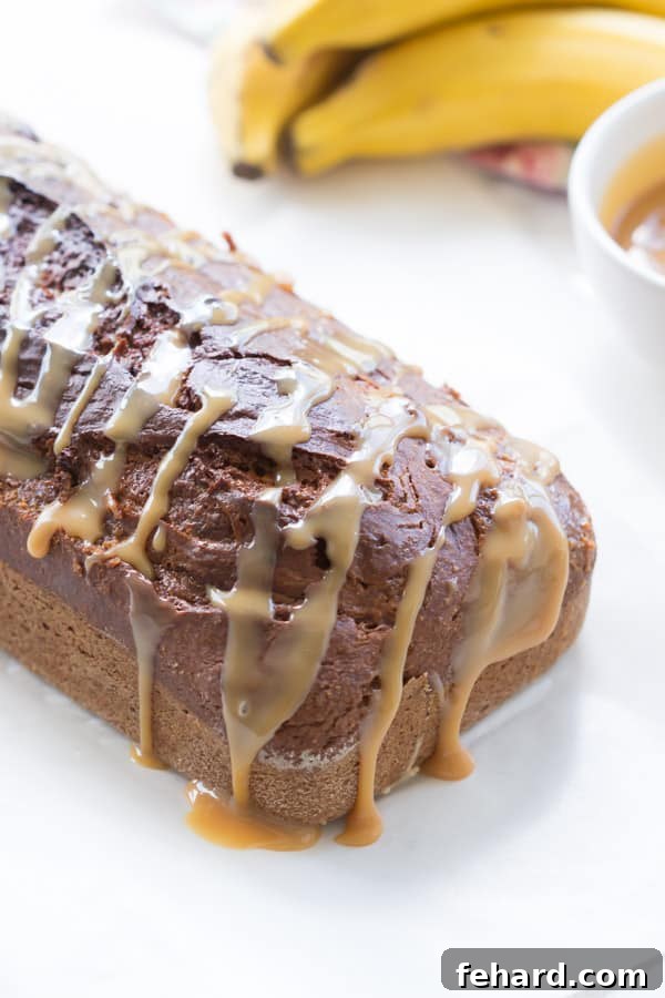 Delicious Swirl in Dulce de Leche Banana Bread Close-up of a slice of Dulce de Leche Banana Bread, showing the moist crumb and caramel swirl