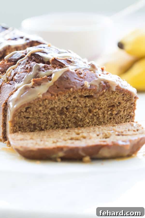 Perfectly Sliced Dulce de Leche Banana Bread Four slices of Dulce de Leche Banana Bread arranged on a wooden board, ready to serve
