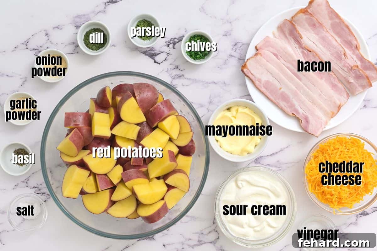 Ingredients for bacon ranch potato salad labeled on counter, including red potatoes, sour cream, mayonnaise, ranch seasoning, cheese, and chives.