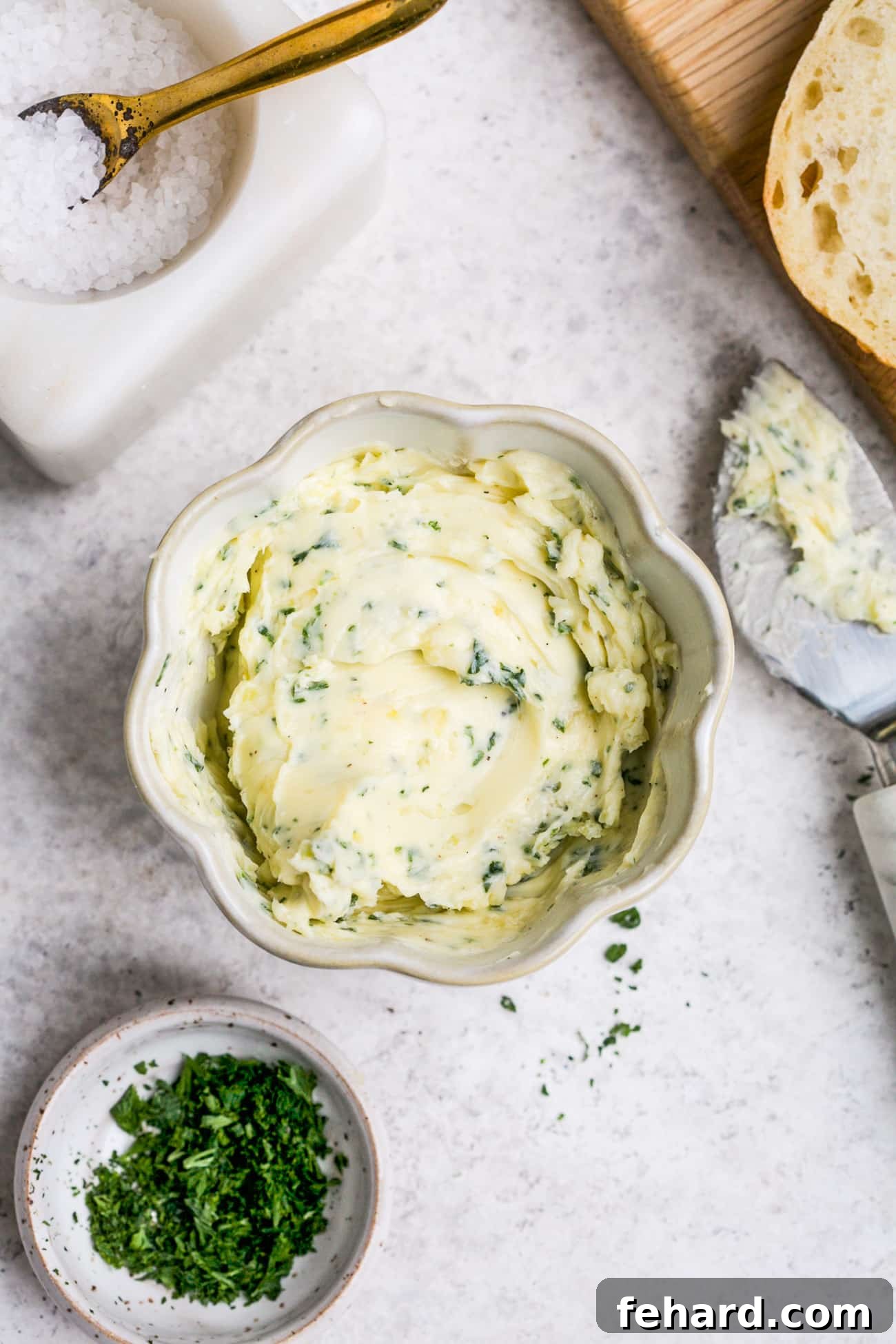 Golden Garlic Spread 2 Garlic butter in a small, white bowl.