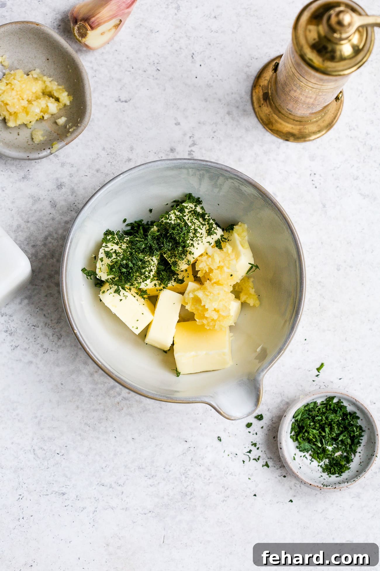 Golden Garlic Spread 4 Ingredients measured into a small bowl.