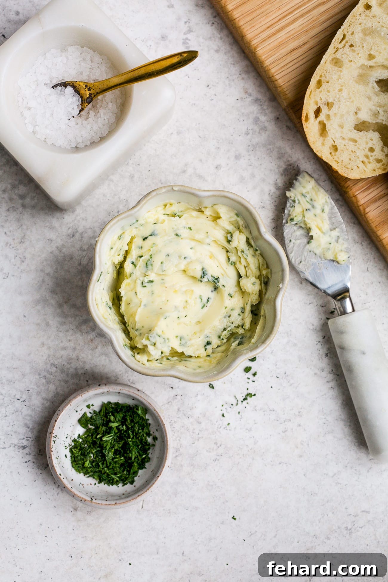Golden Garlic Spread 5 Garlic butter in a small, white bowl.
