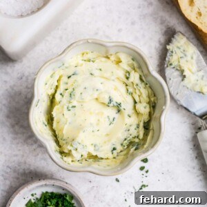 Golden Garlic Spread 6 overhead view of garlic butter in a small white bowl