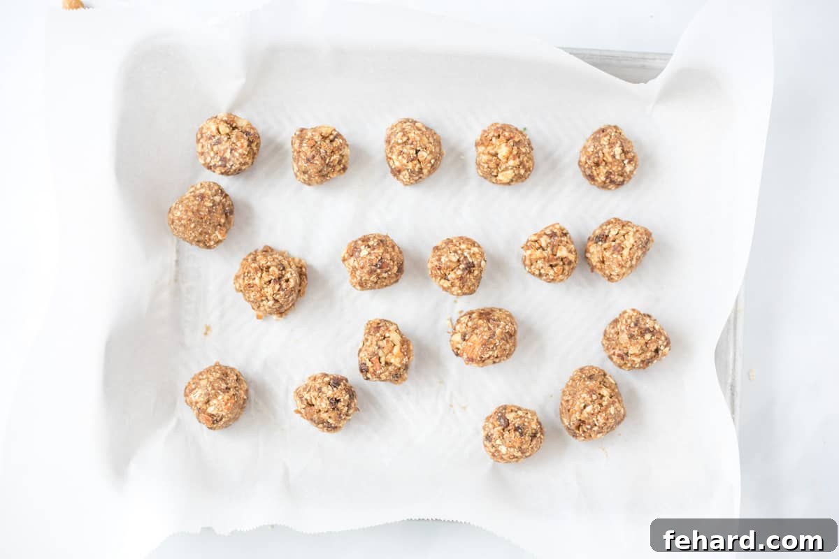 Energy Ball Recipe Ready to Chill Freshly rolled Energy Balls arranged on a sheet pan, ready to chill.