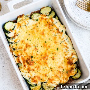 Zucchini casserole in a large, white baking dish.