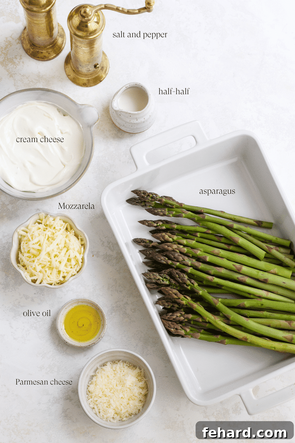 Golden Asparagus Gratin 3 Collection of ingredients laid out for making asparagus casserole.