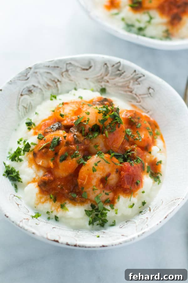 Shrimp and creamy cauliflower mash served in a bowl