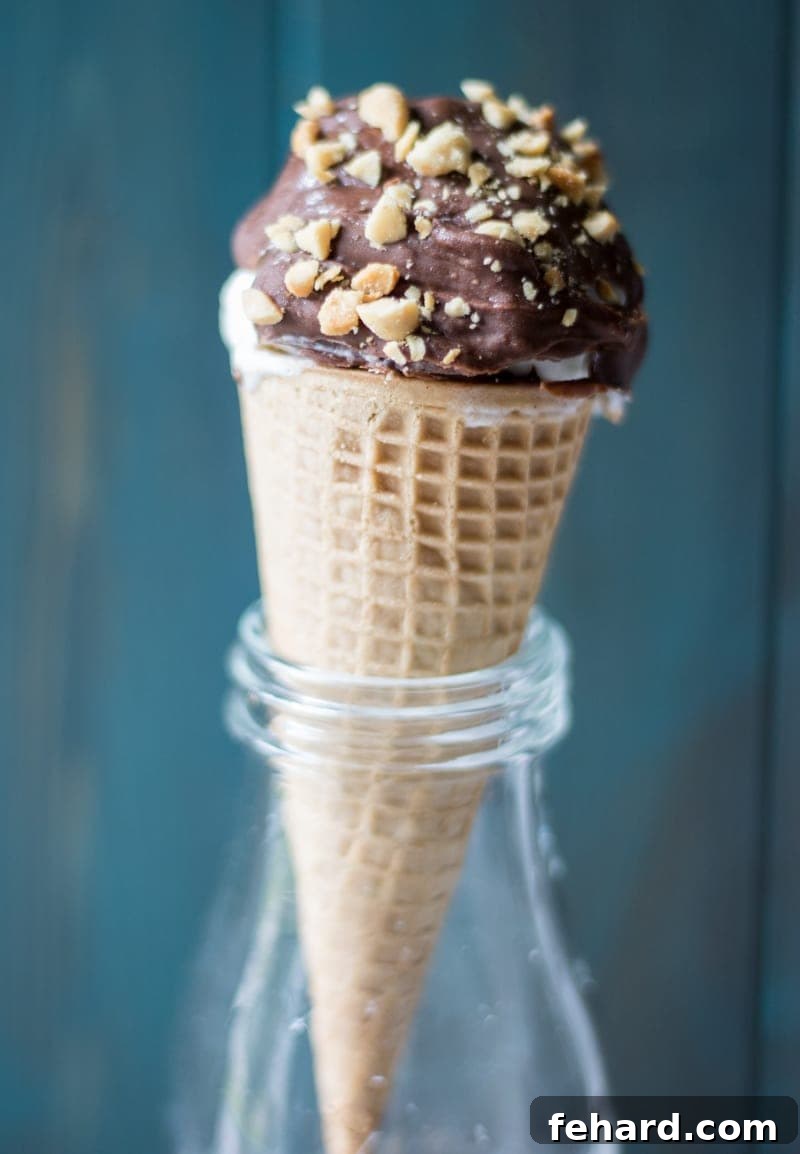Homemade Drumstick Ice Cream Cone Recipe Homemade Drumstick Ice Cream Cone in a glass bottle, perfectly dipped in chocolate and covered with peanuts.