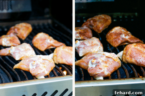 Raw chicken thighs cooking on the grill with visible grill marks