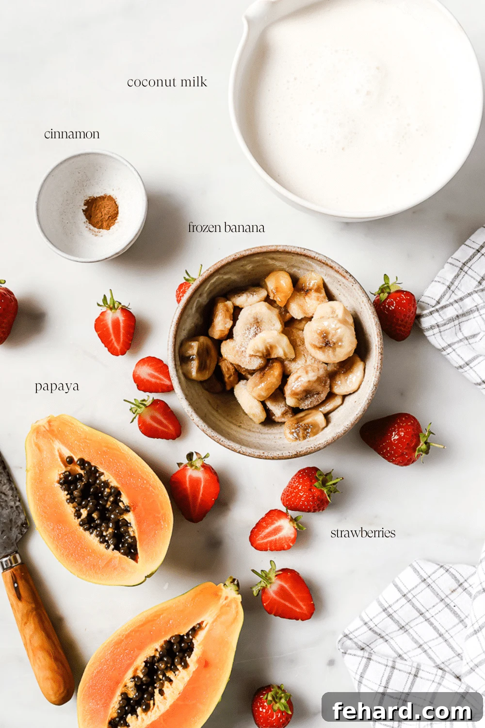 Pre-measured ingredients in small bowls on a white countertop.