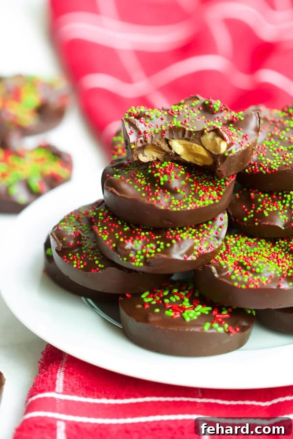 Christmas Almond Chocolate Cups - Simple & Quick Dessert Close-up of festive Christmas Almond Chocolate Cups, showcasing the crunchy almonds and vibrant sprinkles.