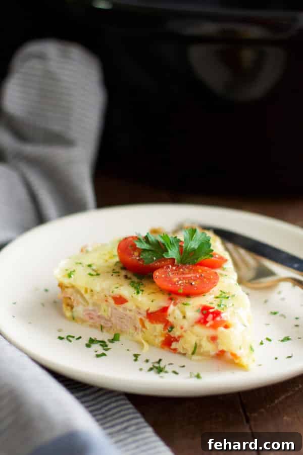 Christmas Morning Slow Cooker Omelet - The perfect make-ahead Christmas breakfast. Christmas Morning Slow Cooker Omelet - Enjoy a delicious, make-ahead breakfast with eggs, almond milk, bell pepper, onions, ham, and cheese, perfect for a stress-free holiday morning.
