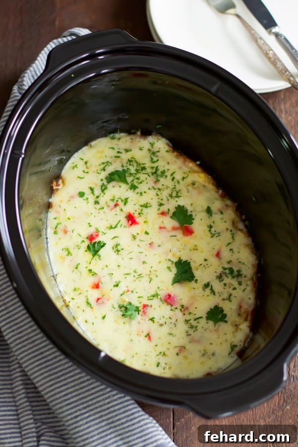 Christmas Morning Slow Cooker Omelet - Wholesome ingredients for a festive meal. Christmas Morning Slow Cooker Omelet - A close-up of the delicious omelet with fresh ingredients like bell peppers and ham, perfect for holiday breakfast.