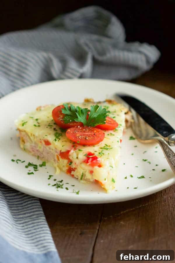 Christmas Morning Slow Cooker Omelet - Garnish and serve for a beautiful presentation. Christmas Morning Slow Cooker Omelet - Ready to be served, garnished with fresh parsley and cherry tomatoes, showcasing a perfect holiday breakfast.