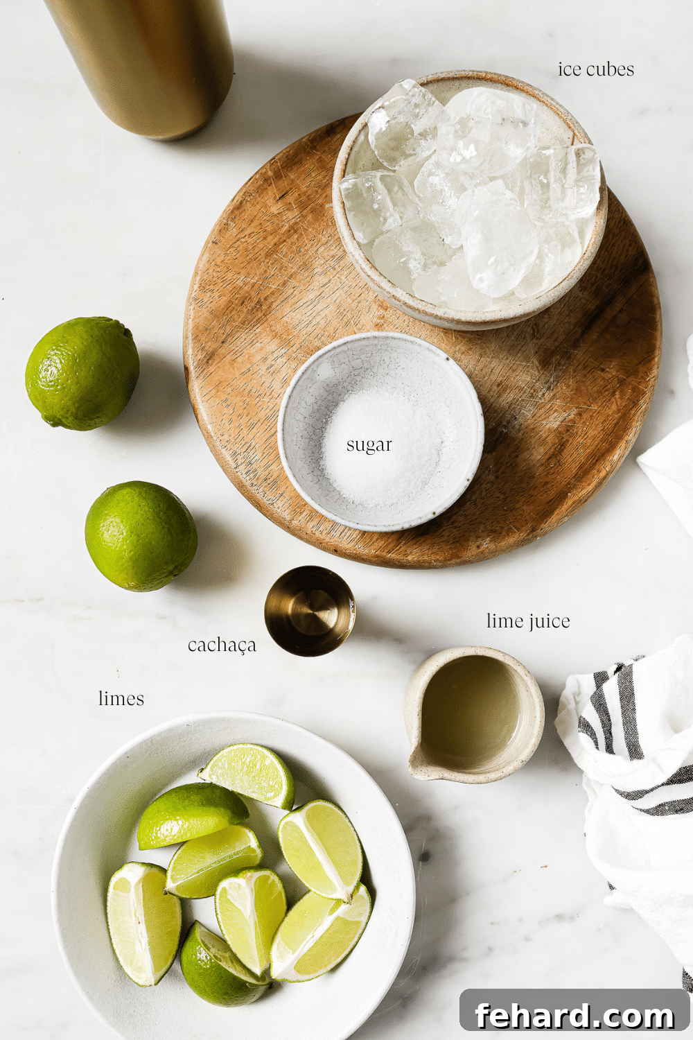 Caipirinha: Brazil's Signature Cocktail 3 Pre-measured ingredients for Caipirinha: limes, sugar, cachaça, and ice.