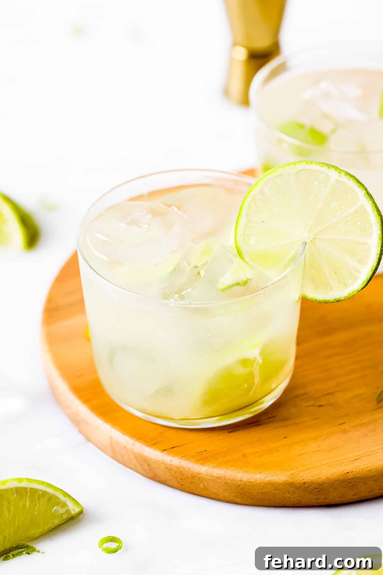 Caipirinha: Brazil's Signature Cocktail 5 A close-up shot of a Caipirinha glass, perfectly garnished with a lime wedge, highlighting its refreshing appeal.