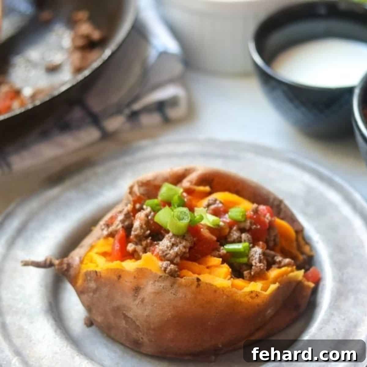 A generously stuffed sweet potato, overflowing with savory taco meat and melted cheese, perfect for super simple dinner ideas.