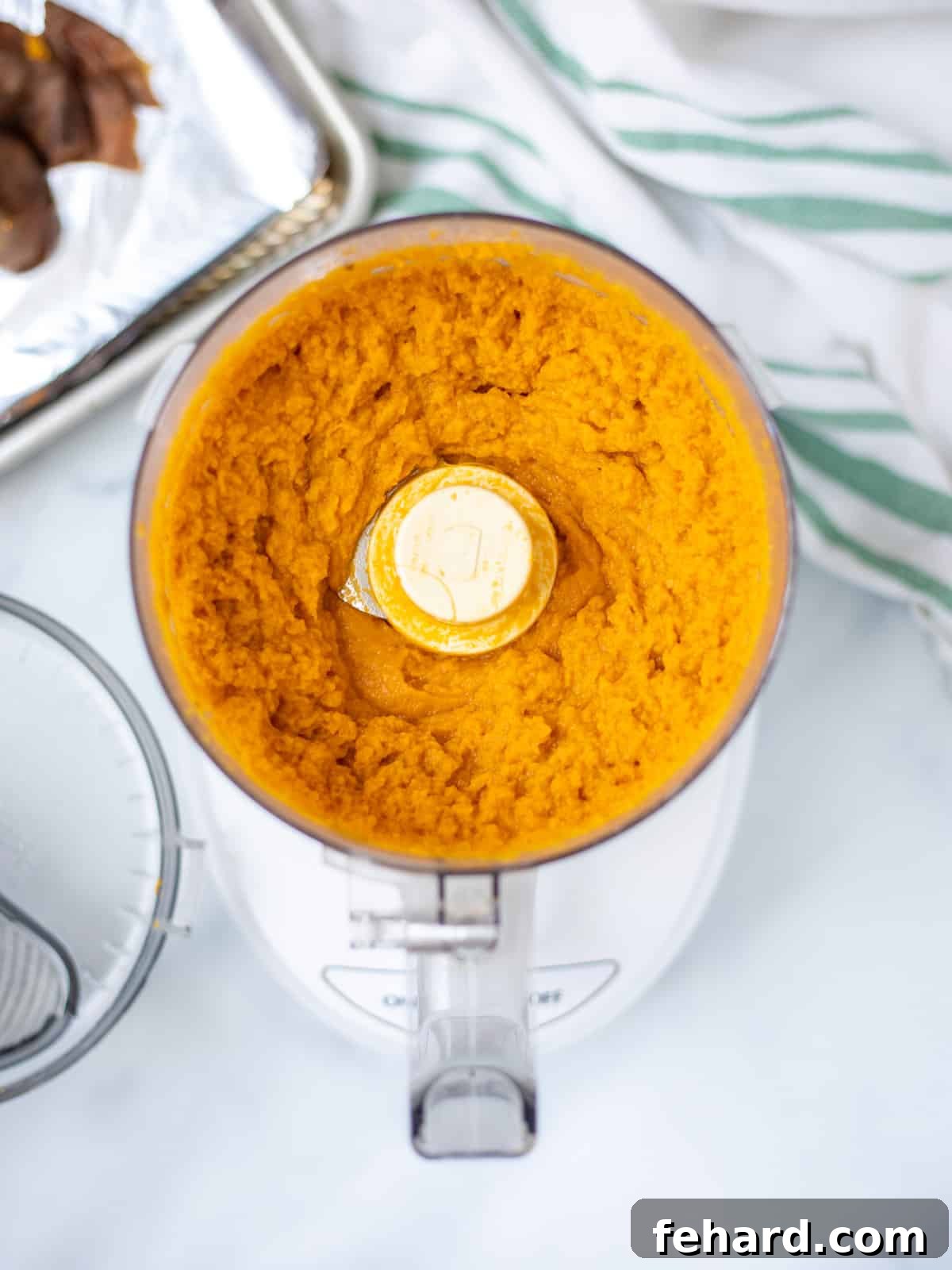Velvety Homemade Sweet Potato Puree 2 Sweet Potato Puree in a food processor, ready to be blended into a smooth consistency.