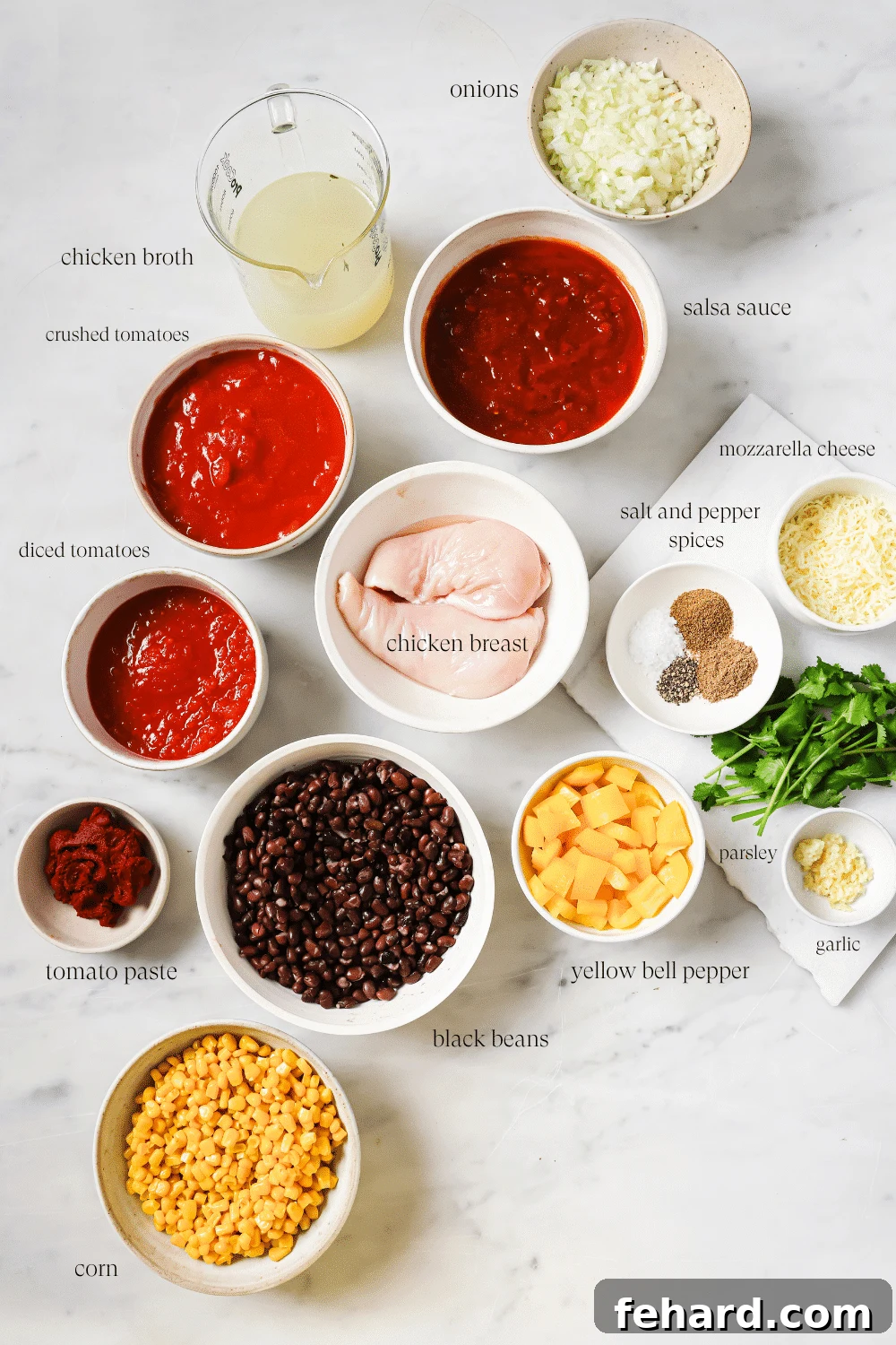 Pre-measured chicken chili ingredients divided into bowls.