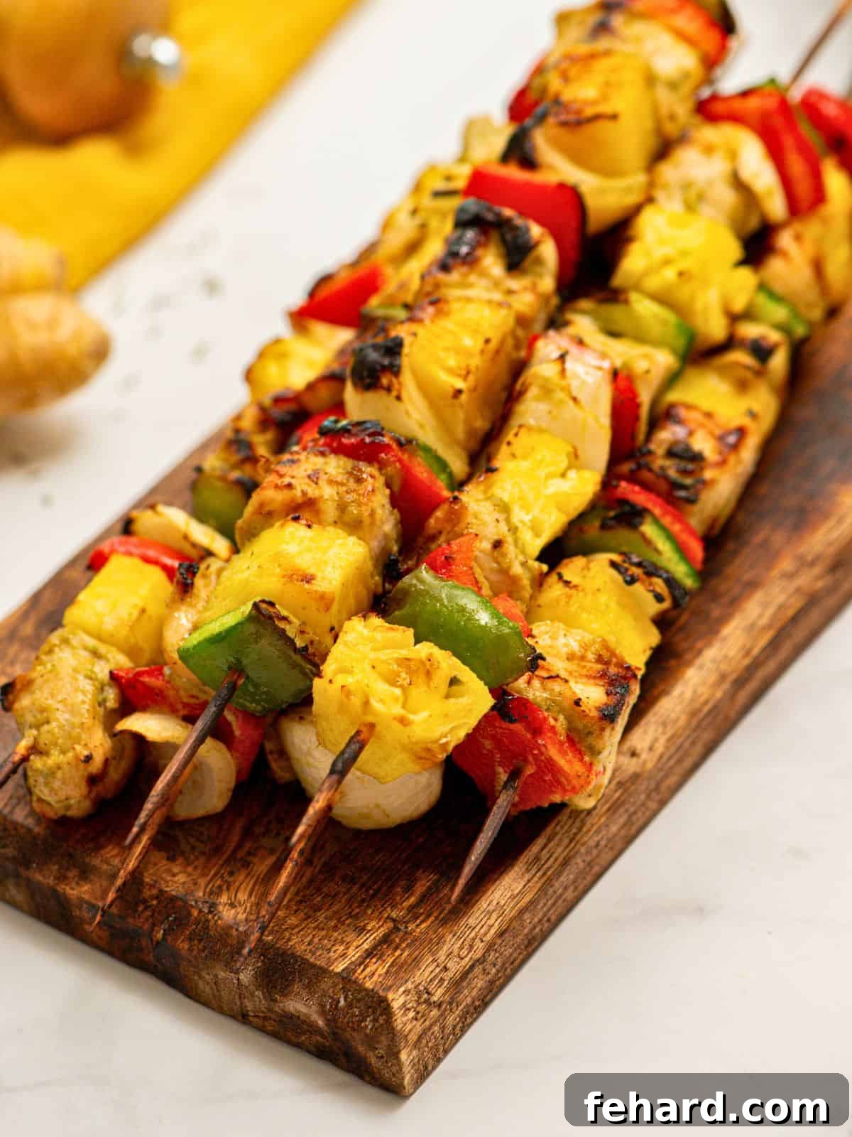 Spicy Grilled Jerk Chicken Skewers 2 Grilled jerk chicken kabobs with pineapple, peppers, and onions, beautifully charred and ready to serve.