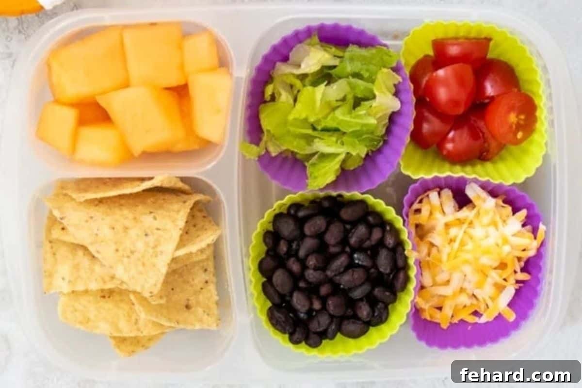 Bento box with ingredients for nachos.