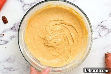 Sweet potato pancake batter in glass bowl.
